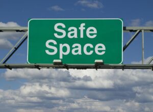 Highway overhead sign saying "Safe Space"